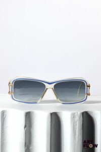 CAZAL Paire de lunettes de soleil bleues et transparentes, verres noirs, monture en métal doré Bon état général (quelques rayures sur les verres)