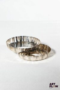 Deux petits moules à tarte circulaires en argent. Poids brut : 110 g Diamètre : 9 cm environ