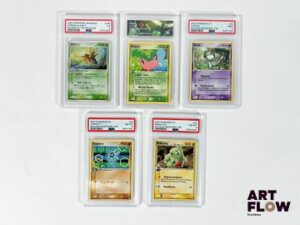 Ensemble de 5 cartes Pokémon gradées du Bloc Ex. - Shedinja (Munja) 006/054 - Holographique - Rulers of the Heavens - PSA 5 (Excellent) - en japonais. - Hoppip (Granivol) 57/109 - Commune - Team Rocket Returns - CollectAura "Voggt" - en anglais. - Tarsal 60/101 - commune - Ex îles des Dragons - PSA 9 (Neuf) - en français. - Ymphect 58/101 - commune - Ex îles des Dragons - PSA 8 (Proche du Neuf) - en français. - Embrylex 52/101 - commune - Ex îles des Dragons - PSA 8 (proche du Neuf) - en français.