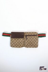 GUCCI Sac porté ceinture en tissu monogrammé et empiècement en cuir, la ceinture au motif rayé Web vert et rouge de la maison H. 17 x L 30 cm Usures d'usage