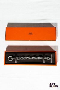 HERMÈS Modèle chaîne d'encre Bracelet en argent L. 20,5 cm Poids : 73,03 g Dans sa boîte d'origine Très bon état général malgré quelques très légers défauts (petites usures d'usage)