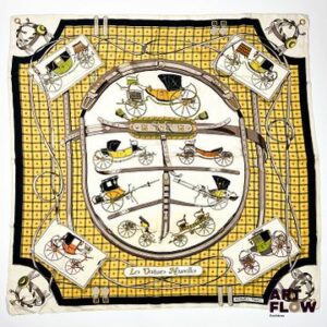 HERMÈS Modèle "Les voitures nouvelles" Carré en twill de soie dans les tons jaunes, dessiné par Jacques EUDEL 90 x 90 cm Bon état général malgré quelques légers défauts (tâches)