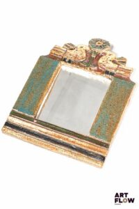 LES ARGONAUTES - Vallauris - Miroir en céramique émaillée polychrome à motifs de fleurs et d'oiseaux - signé au revers "les argonautes Vallauris" H. 25,5 x L. 18 cm