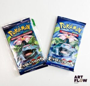 Lot de 2 boosters Pokémon de la série du bloc XY : Évolutions. Illustrations Florizarre. Scellés et un sous security seal En français.