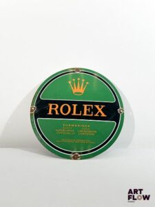 Plaque émaillée ronde d'après Rolex Diamètre : 30 cm Petits éclats et traces de rouille - moderne