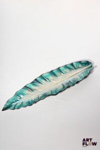 POL CHAMBOST (1906-1983) Importante coupe feuille en faience à couverte polychrome, le revers à couverte noire. Incisé au revers "Poterie Pol Chambost, Made in France" 66 x 16 x 6 cm Bibliographie : Philippe Chambost, "Pol Chambost, Sculpteur-Céramiste 1906-1983", Somogy Editions d'Art, Paris, 2006, modèle similaire p. 75