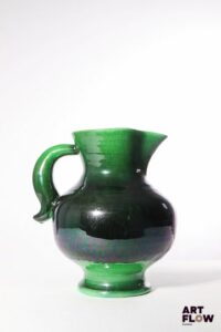 POL CHAMBOST (1906-1983) Pichet 820 en faience à couverte polychrome en dégradé vert et noir. Porte un cachet "820", et incisé "Made in France" 28 x 24 x 20 cm env. Bibliographie : Philippe Chambost, "Pol Chambost, Sculpteur-Céramiste 1906-1983", Somogy Editions d'Art, Paris, 2006, modèle similaire p. 55