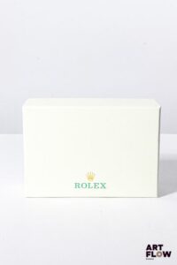 ROLEX Paire de jumelles en acier laqué vert. Dans son pochon et boîte. Très bon état général.