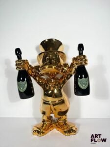 The Nineties "LV Picsou is ready for Champagne" Sculpture Pop Art en résine chromée. Edition limitée, numérotée 2/2, signée, avec certificat d’authenticité. Dimensions : 43 x 29 cm