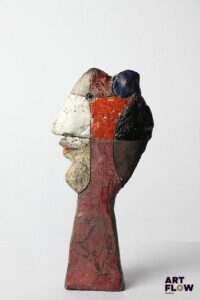 Roger CAPRON (1922-2006) "Visage de profil" Sculpture en céramique polychrome partiellement émaillée Signée H. 20 cm Infimes éclats