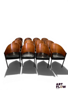 PHILIPPE STARCK POUR DRIADE Modèle COSTES Suite de 12 fauteuils en acier et bois, l'assise en cuir rembouré En l'état (accidents, manques)