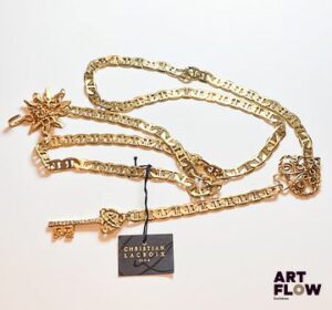 Christian LACROIX Ceinture en métal doré à décor de soleil, cœur et clé Longueur totale 105 cm