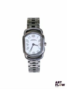 HERMÈS Paris Modèle Rallye Montre bracelet de dame en acier Mouvement à quartz Fond clipsé Dimensions boitier : 20 x 30 mm Dans sa boîte Très bon état général malgré quelques rayures d'usage Expert : Alexis Francis Boeuf