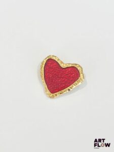 JACQUES ESTEREL Broche en forme de coeur stylisé en métal doré