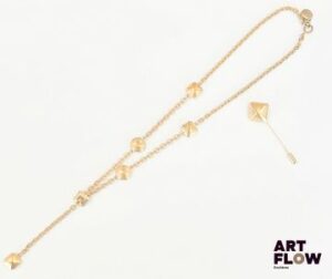 Jecques ESTEREL Collier lariat en métal doré orné de cercles et de carrés à pans coupés On y joint une épingle a chapeau assortie