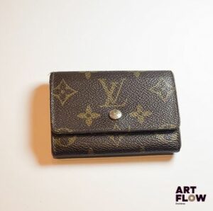 LOUIS VUITTON Portefeuille en toile Monogramme 7 x 10 cm En l'état